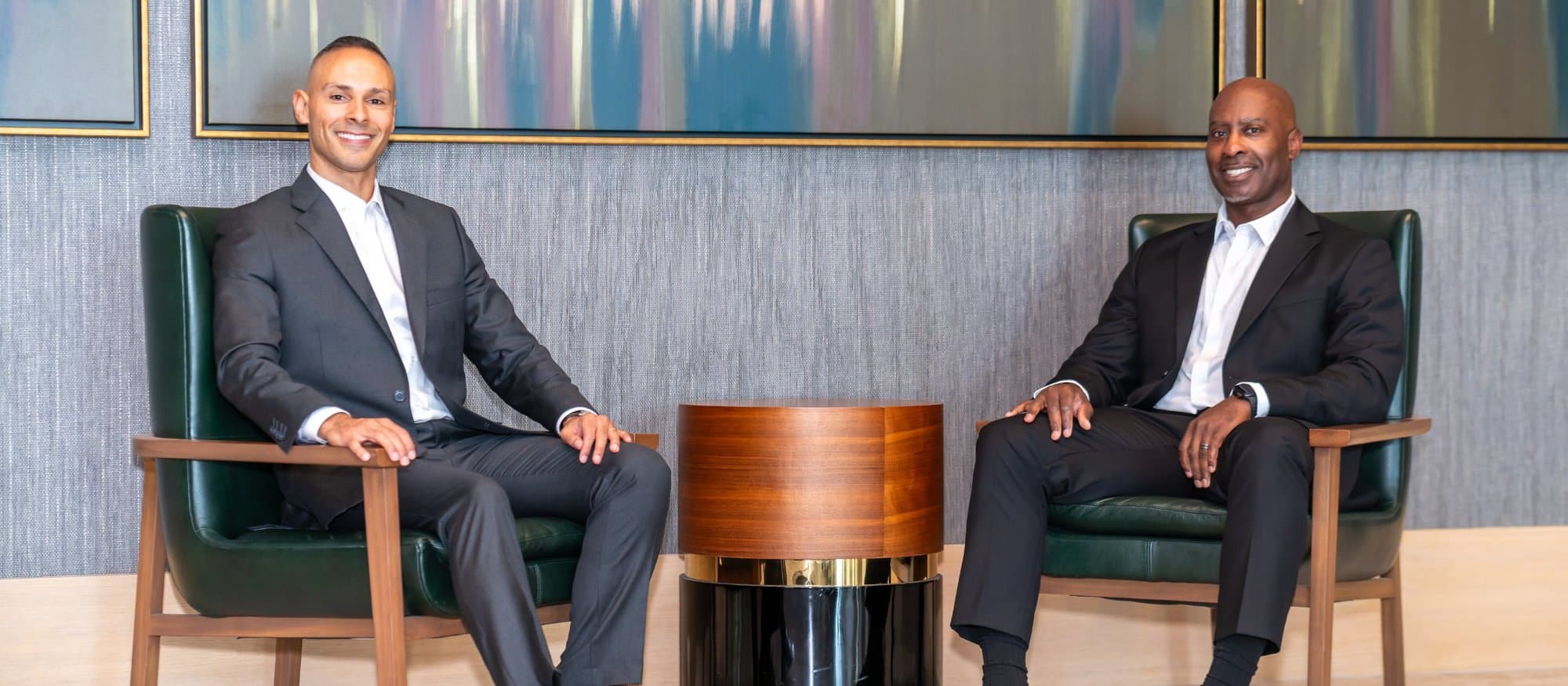 Two BEM members seated in a hotel lobby