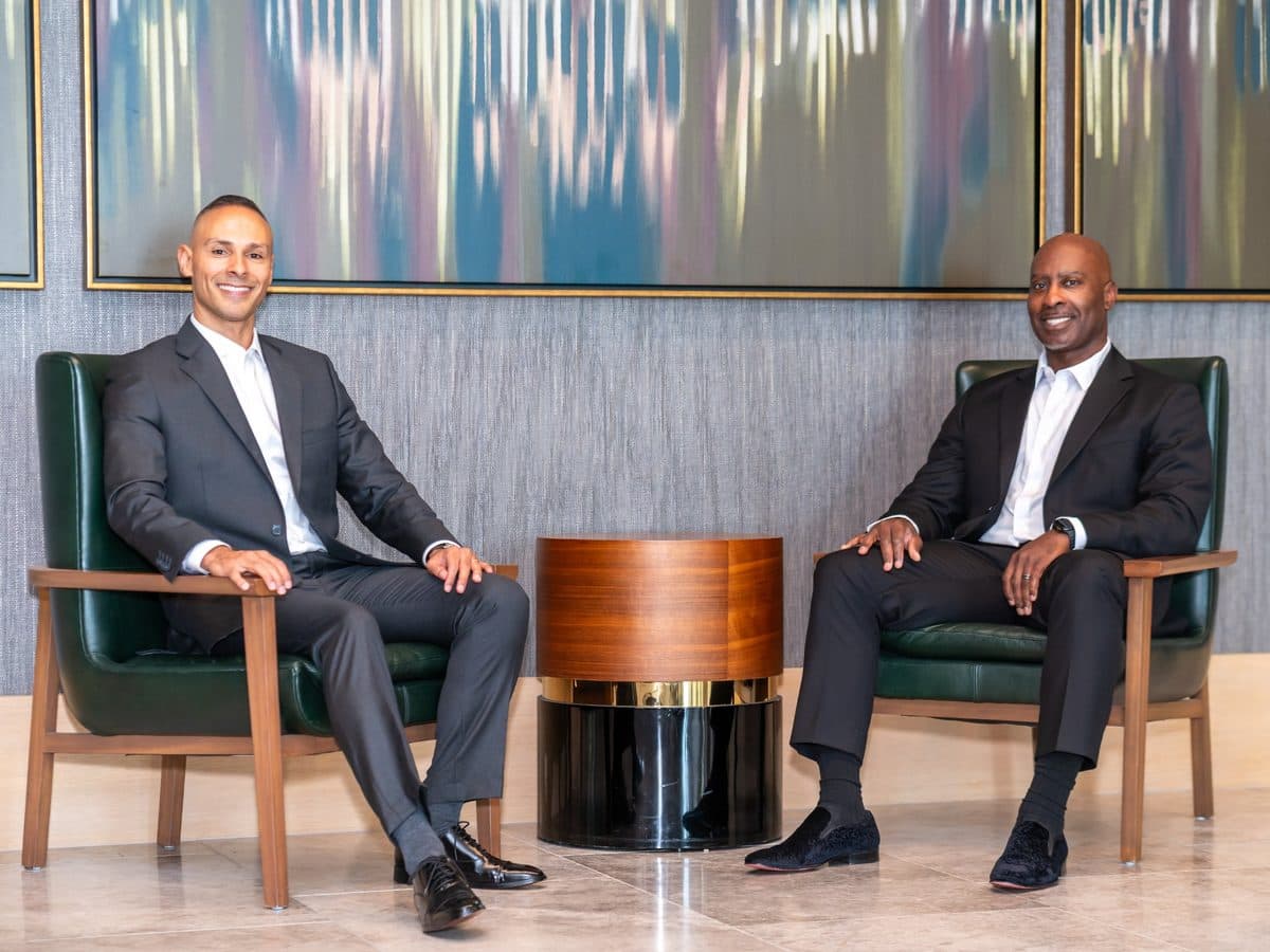 Two members seated together in a hotel lobby